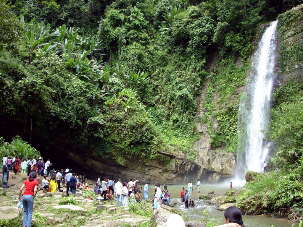 Madhabkunda Waterfall flowing over a rocky hillside in Moulvibazar